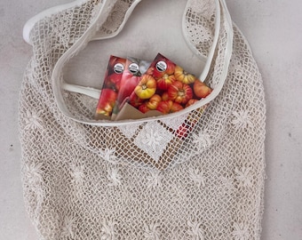 Handmade bespoke shoulder bag out of vintage cotton lace.