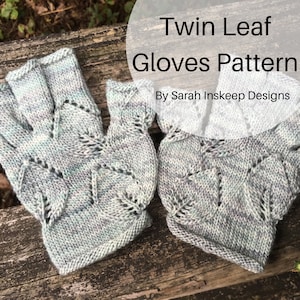 May include: A pair of grey fingerless gloves with a leaf pattern. The gloves are knitted and have a delicate, lacy design. The text "Twin Leaf Gloves Pattern by Sarah Inskeep Designs" is visible in the image.