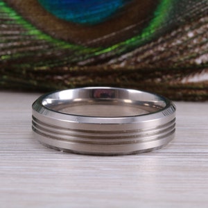 Titanium patterened band, light weight and very durable, choice of widths , perfect as wedding band or fashion ring