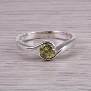 Dainty Silver Solitaire ring set with beautiful 5 mm round cut Peridot Cubic Zirconia