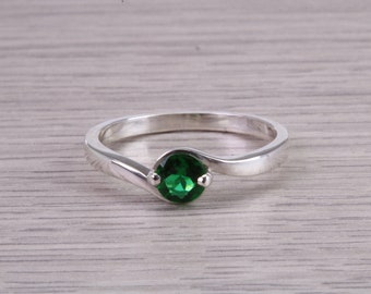 Dainty silver solitaire ring set with beautiful round Emerald C Z, birthstone for May,ideal as promise ring. Perfect gift for all occasions