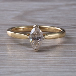 Half carat Marquise cut Certified Diamond set Gold Solitaire