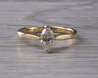 Half carat Marquise cut Certified Diamond set Gold Solitaire