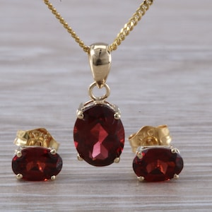 Oval cut Garnet Earrings and Matching Necklace set in Yellow Gold