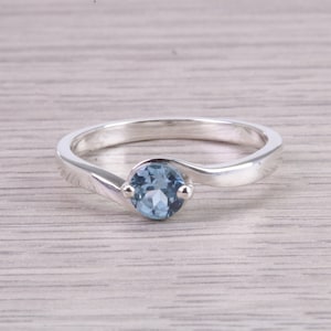 Dainty Silver Solitaire ring set with beautiful round cut Aquamarine Cubic Zirconia