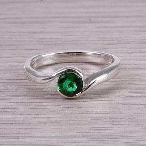 Dainty silver solitaire ring set with beautiful round 5 mm Emerald C Z, birthstone for May