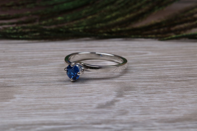 Silver solitaire ring with four claw twist setting of beautiful round royal blue sapphire C Z image 5