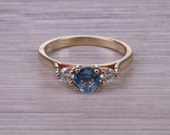 Aquamarine and Diamond set Trilogy Ring