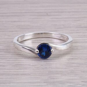 Dainty silver solitaire ring set with beautiful round Sapphire C Z, birthstone for May,ideal as promise ring. Perfect gift for all occasions