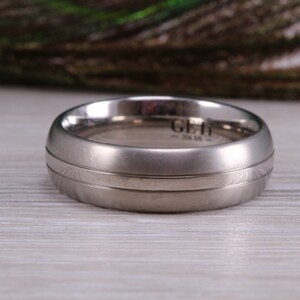 Titanium patterened band, light weight and very durable, choice of widths , perfect as wedding band or fashion ring