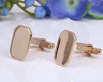 Gemelos de oro macizo y pesado, hechos de oro fundido macizo.