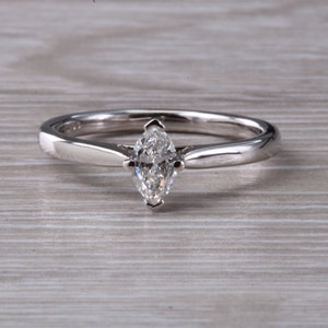 Minimalist Marquise cut Diamond set Platinum Solitaire