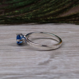 Silver solitaire ring with four claw twist setting of beautiful round royal blue sapphire C Z image 6