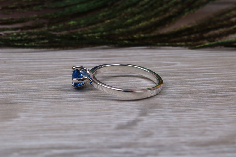 Silver solitaire ring with four claw twist setting of beautiful round royal blue sapphire C Z image 6