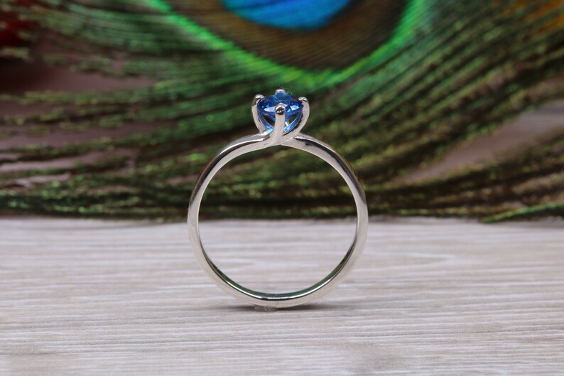 Silver solitaire ring with four claw twist setting of beautiful round royal blue sapphire C Z image 10