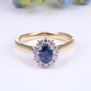 Beautiful Blue Sapphire and Diamond Halo set 18ct Yellow Ring, British Hallmarked