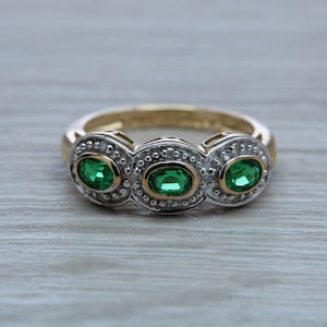 Three Emeralds and Diamonds set Yellow Gold Ring