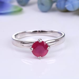 1.30ct round cut Natural Ruby set in this Twist Shank Platinum Solitaire