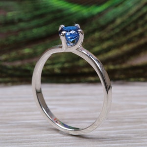 Silver solitaire ring with four claw twist setting of beautiful round royal blue sapphire C Z image 2