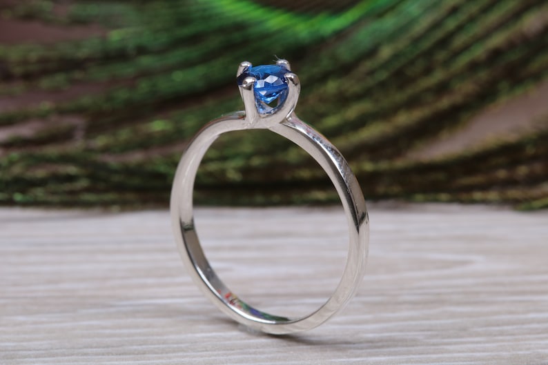 Silver solitaire ring with four claw twist setting of beautiful round royal blue sapphire C Z image 2