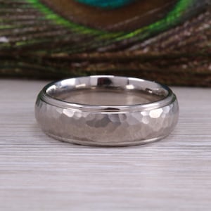 Titanium patterened hammered finish band, light weight and very durable, choice of widths , perfect as wedding band or fashion ring