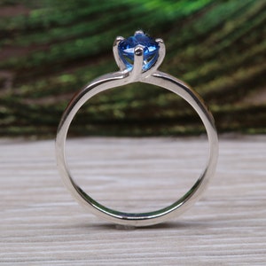 Silver solitaire ring with four claw twist setting of beautiful round royal blue sapphire C Z image 3