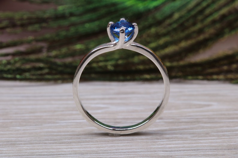 Silver solitaire ring with four claw twist setting of beautiful round royal blue sapphire C Z image 3