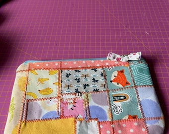 Gewatteerd patchwork zakje met ritssluiting/make-uptasje