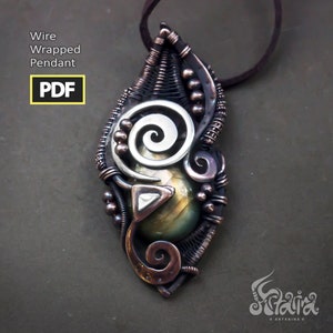 May include: A silver and copper wire wrapped pendant with a green and gold gemstone. The pendant is in the shape of a leaf and has a spiral design. The pendant is attached to a brown leather cord.