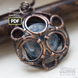 May include: A copper wire wrapped pendant with a blue agate stone in the center. The pendant has a circular design with multiple wire loops.