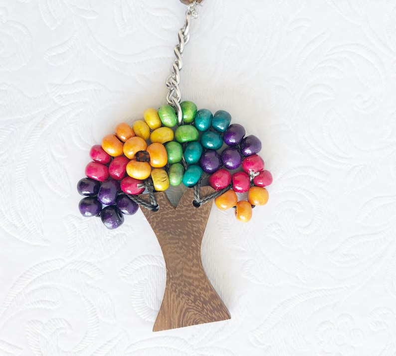 beaded wooden tree of life silver tree of life silver heart with silver tassels silver cross. Suncatchers