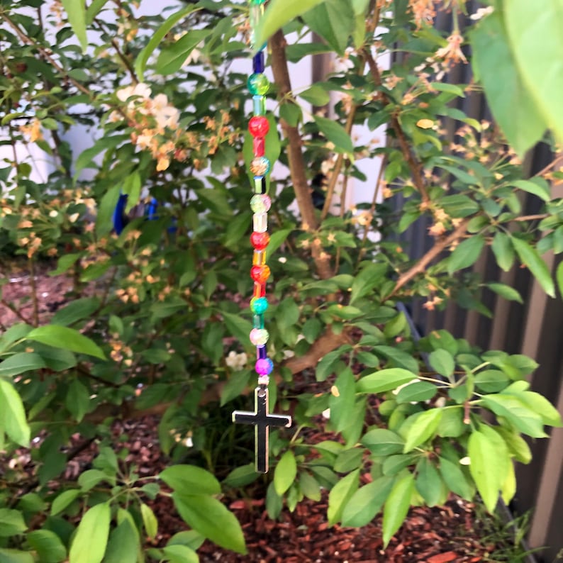beaded wooden tree of life silver tree of life silver heart with silver tassels silver cross. Suncatchers