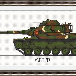 以下が含まれることがあります： 側面に番号 01 が付いた緑と茶色の迷彩柄の軍用戦車。戦車は白い背景にあり、戦車の真下に「M60 A3」という文字が書かれている。