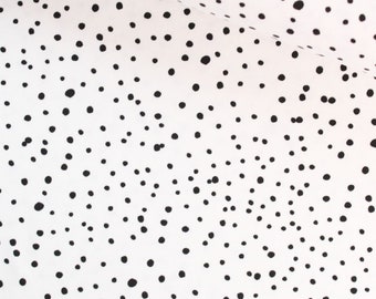 Jersey irregular black dots - Ecru Oeko-tex from 0.5 meters