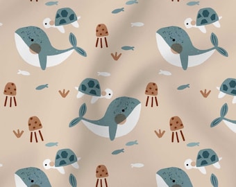 May include: A repeating pattern featuring cartoon whales, turtles, jellyfish, and fish in shades of blue, brown, and white on a beige background. The design has a whimsical, underwater theme, suitable for children's products.