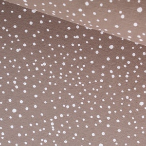 Jersey with irregular dots taupe from 0.5 meters