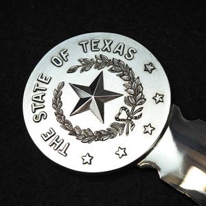 Abrecartas plateado "El estado de Texas" de Christofle France, década de 1960 aproximadamente