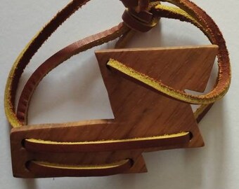 Unique wooden bracelet on a leather string