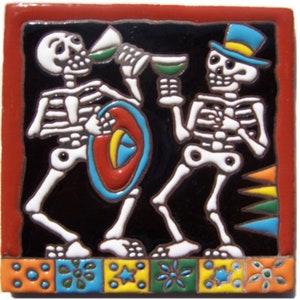 May include: Two skeletons wearing colorful clothing and hats are holding glasses of green liquid. The skeletons are standing on a black background with a colorful border of geometric shapes.