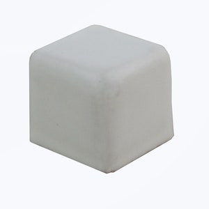 May include: White plastic square corner protector. This corner protector is designed to protect furniture and other objects from damage.