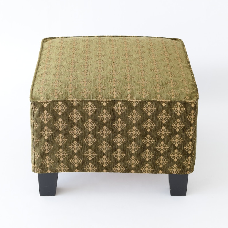 May include: A green and gold patterned square ottoman with black legs.