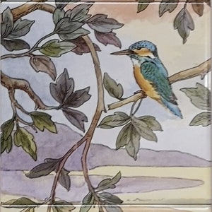 May include: A watercolor painting of a woodland scene with birds and ducks. The painting features a green woodpecker, a blue kingfisher, a brown finch, and three ducks swimming in a blue pond. The background is a light blue sky with green trees and branches.