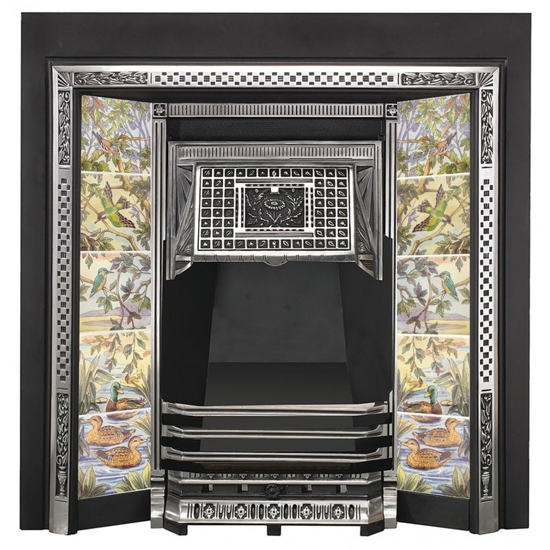 May include: A black cast iron fireplace surround with a silver finish. The surround has a decorative tile design with birds and flowers. The fireplace has a black metal grate and a black metal firebox.