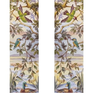 May include: A pair of decorative tiles featuring a symmetrical design of birds and foliage. The tiles depict a variety of birds, including kingfishers, woodpeckers, and ducks, perched on branches and flying through the air. The foliage is a mix of green and brown leaves, creating a lush and vibrant scene.