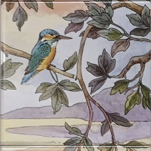May include: A watercolor painting of birds and ducks in a forest setting. The painting features a bluebird, a green woodpecker, a brown bird, and two ducks swimming in a blue stream. The background is a light blue sky with green trees and leaves.