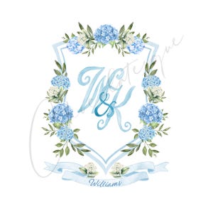 May include: Watercolor design featuring a light blue shield shape with the initials "W & K" in a script font. The shield is framed by blue hydrangeas and green leaves. A light blue banner at the bottom reads "Williams".