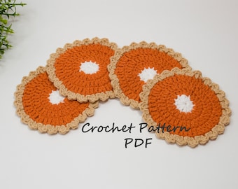 May include: Four crocheted orange and beige coasters with a white center, resembling pumpkin pies. Crochet Pattern PDF.