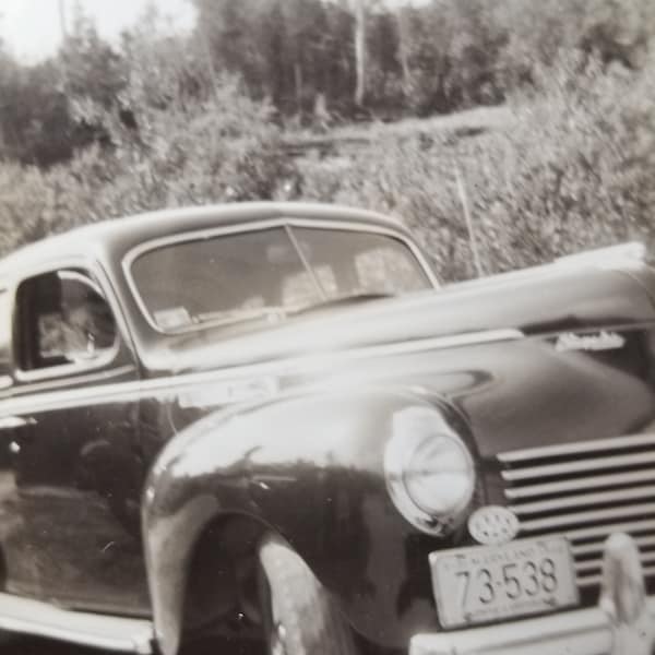 1942 Automobile Car License plate michigan aaa vintage cars bumper body tires bw black white photography outdoors 1940's americana driving