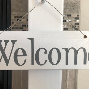 White Decorative Post with “Welcome” sign