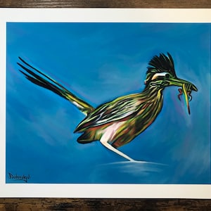 May include: A colorful painting of a roadrunner bird with a long tail and a blue background. The bird is depicted in a dynamic pose, with its head turned to the side and its beak open. The artist's signature, "Prutenveyl", is visible in the bottom left corner.